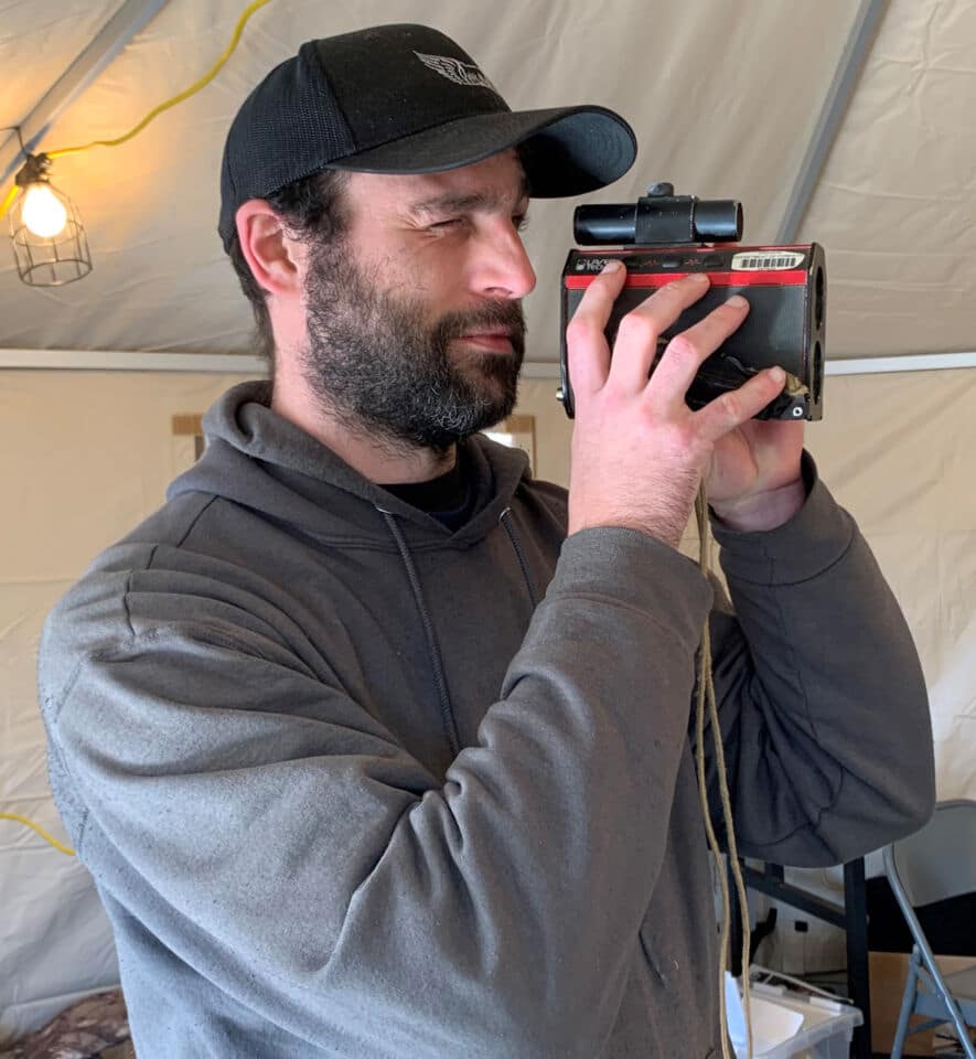 Attendee at the 2022 Oregon Logging Conference poses with their trusty Laser Tech Impulse rangefinder, a discontinued Laser Tech product known for its ruggedness and longevity.