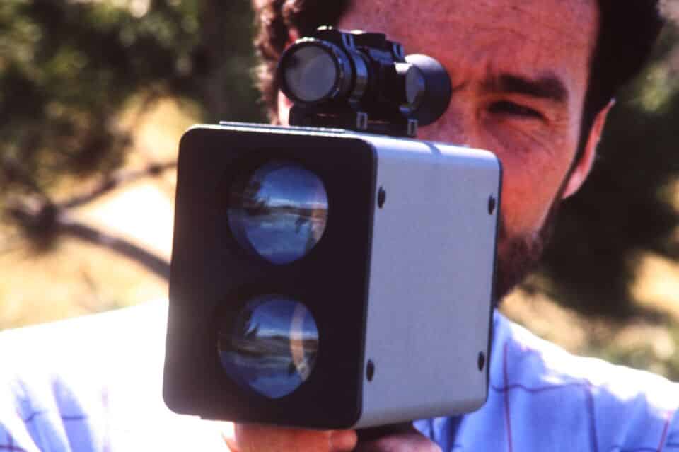 David Williams, founder of Laser Tech, poses outdoors with the LTI 20/20 Marksman, the world's first commercial police speed laser.