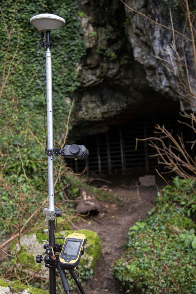Steve Dagnall, Project Researcher working in the Gower Bone Caves, uses a TruPulse rangefinder for various cave mapping tasks.