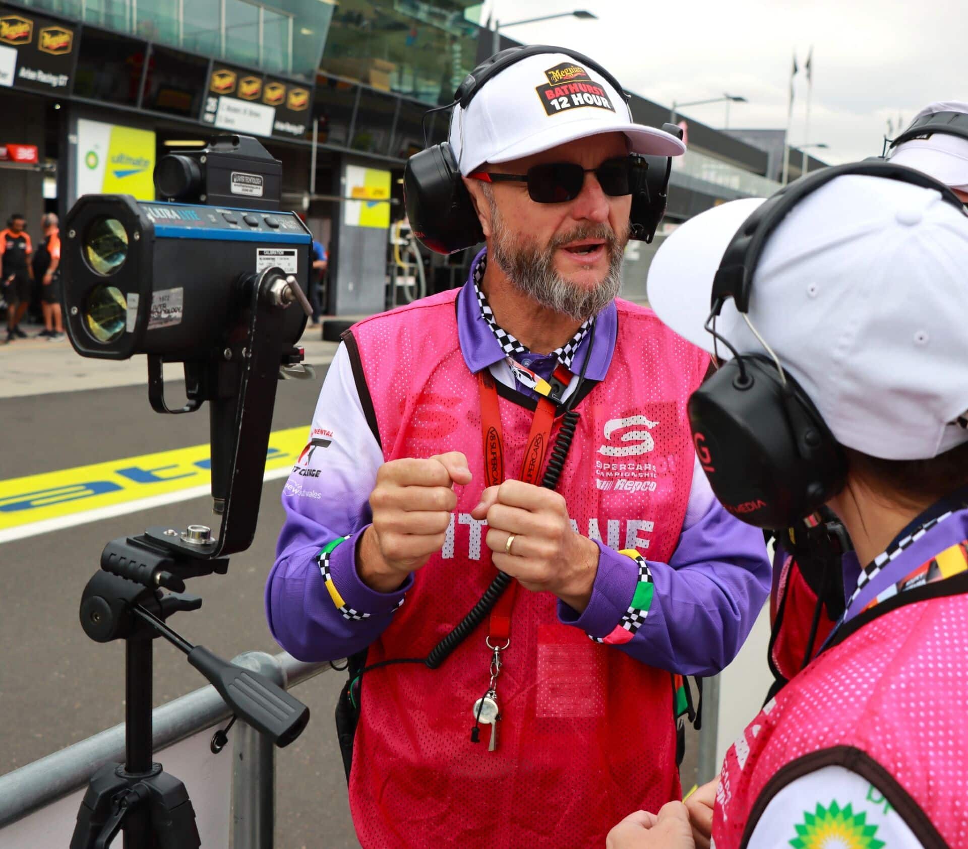 Pit lane crew member stands beside an UltraLyte lidar unit during the 2025 Bathurst 12 Hour.